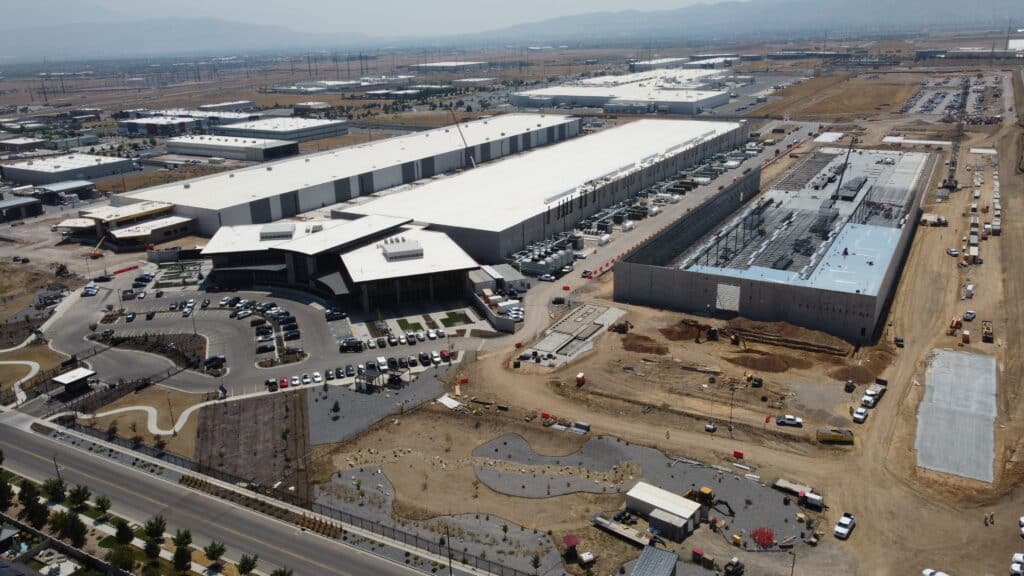 an arial shot of data center buildings in different phases of construction.